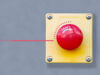 Roter Notfallbutton an grauer Betonwand als abstraktes Bild um Thema IT-Notfallhandbuch